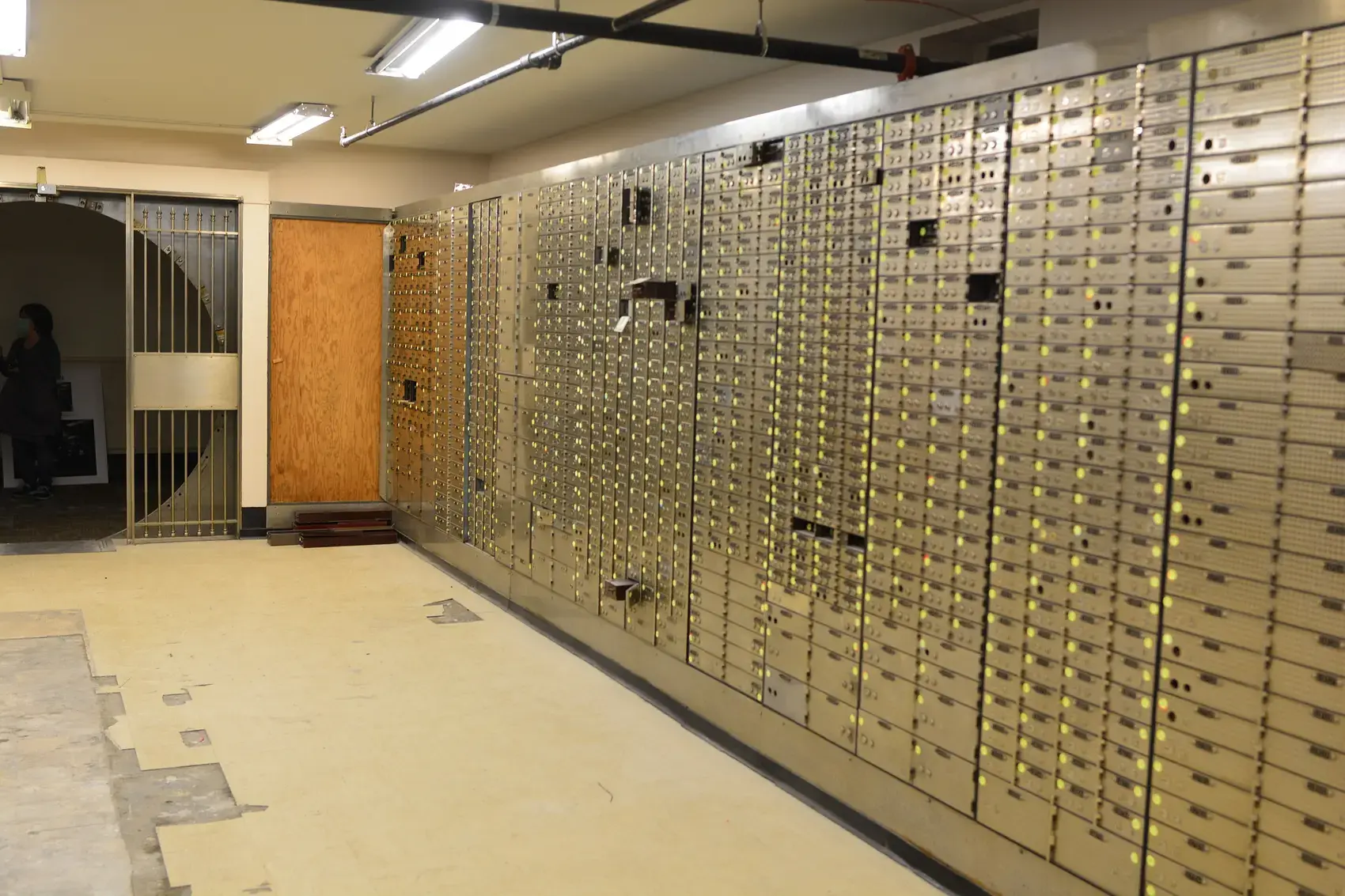 Rows of safe deposit boxes inside a bank vault