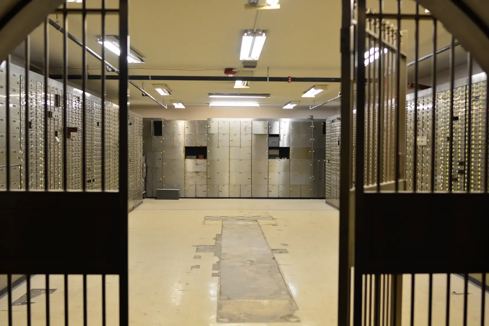 The barred gate of a bank's safe deposit vault